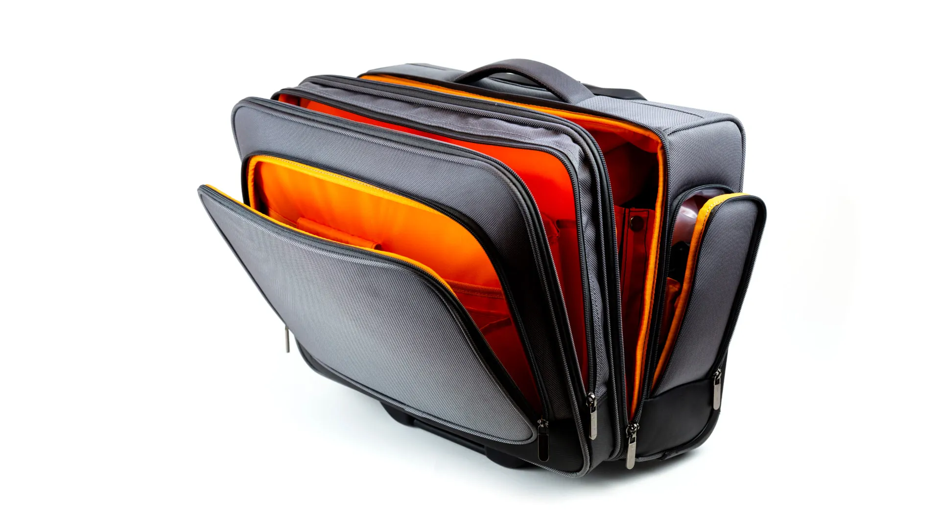 The wheeled trolley case with every compartment unzipped, showing the orange lined main section, the padded laptop sleeve and the side pockets.
