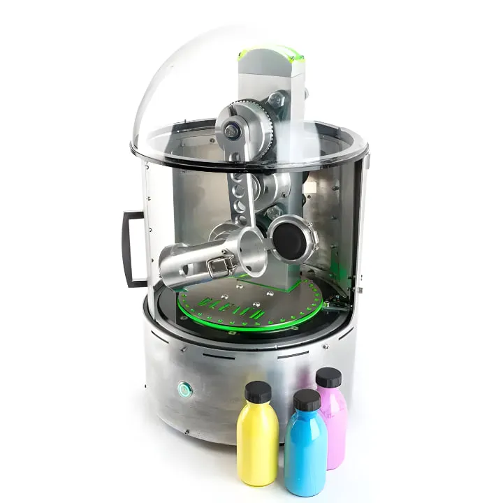 The Bleach mixer, a cylindrical stainless steel machine with a clear domed lid over its shaking mechanism and a green lit turntable, with three bottles of yellow, blue and pink hair dye in front of it.